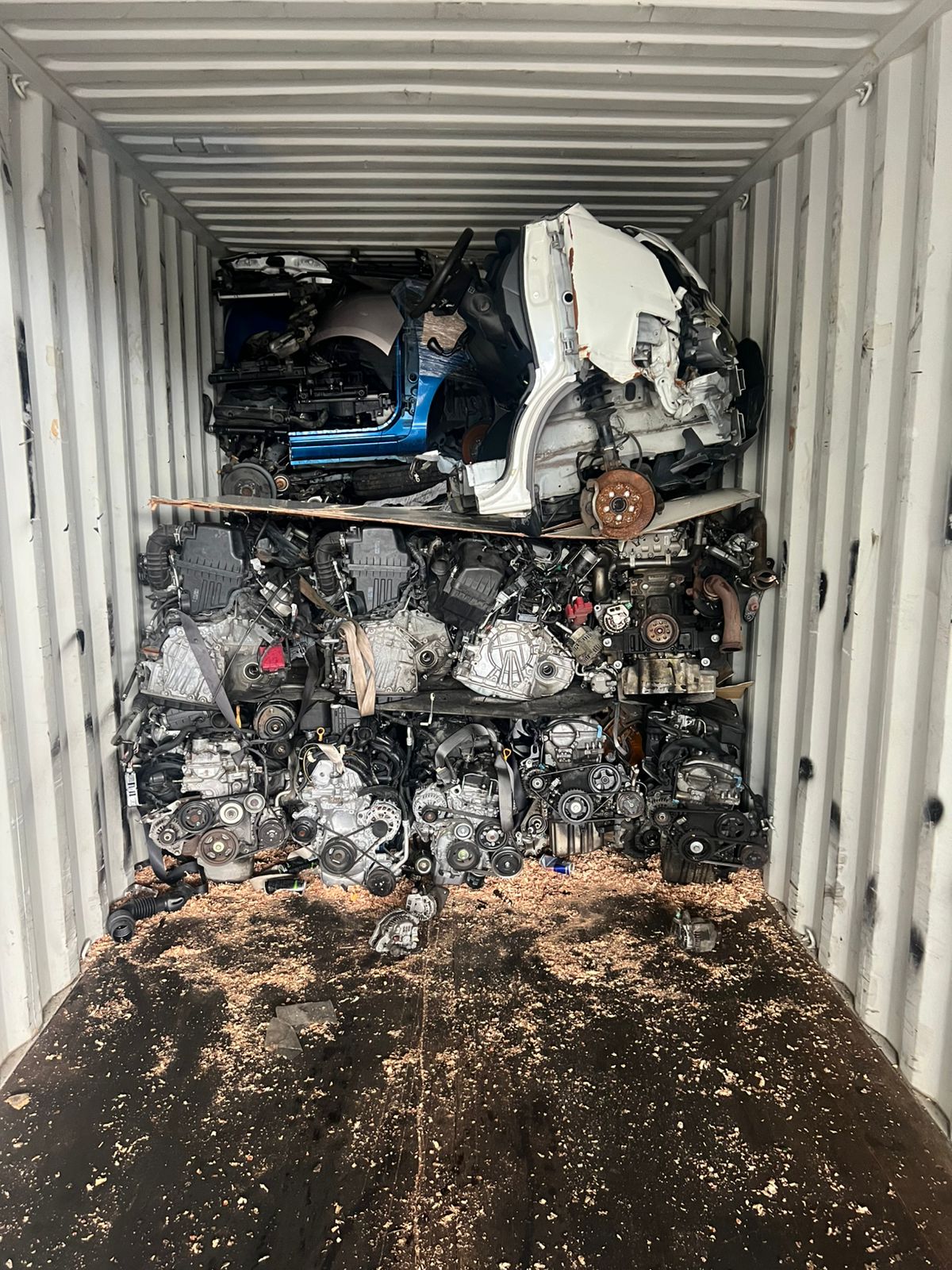 Half-cut body shells secured above engine bay