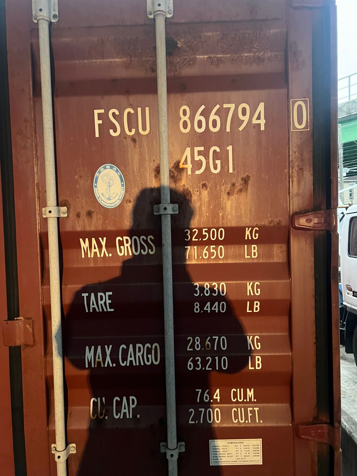 Material list affixed to container sidewall
