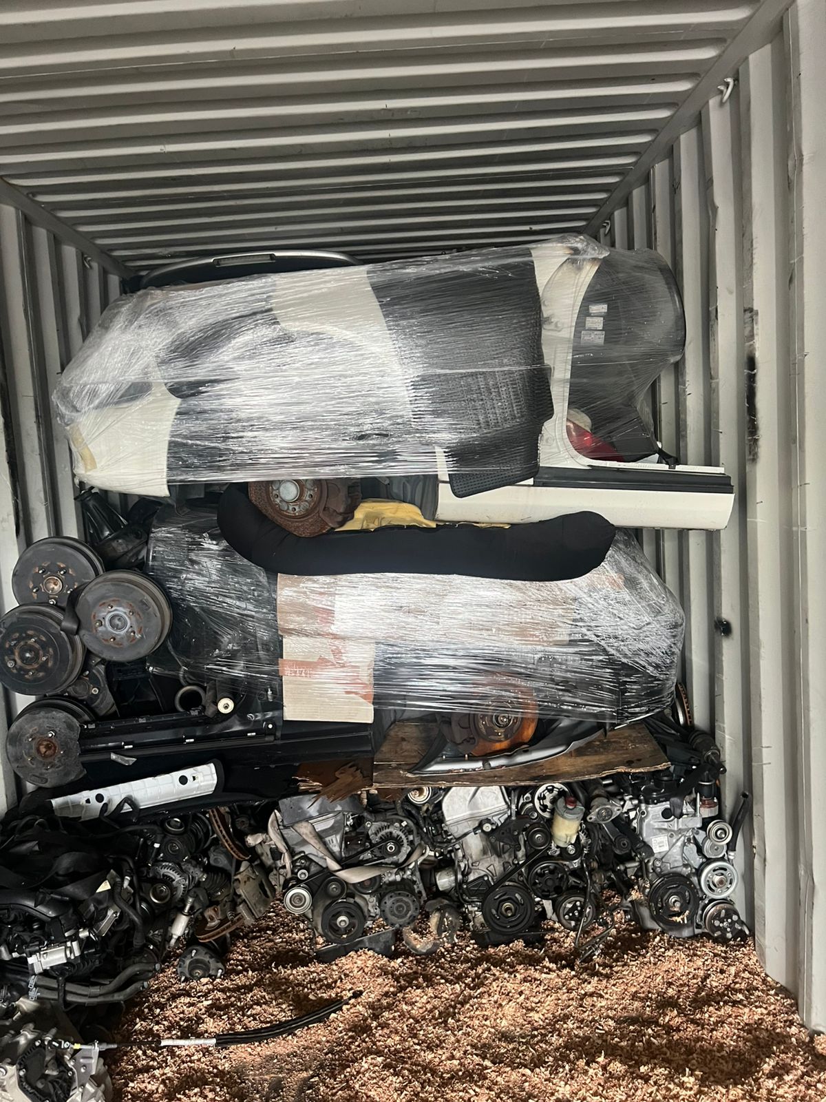 Wrapped body sections layered above driveline