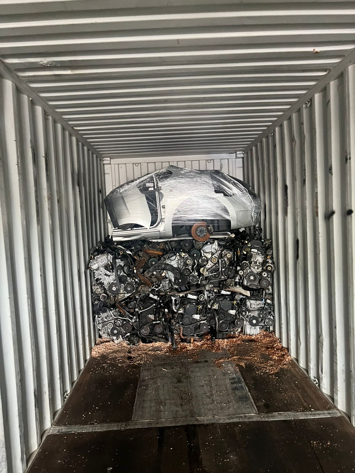 Engine base with wrapped half-cut shell above