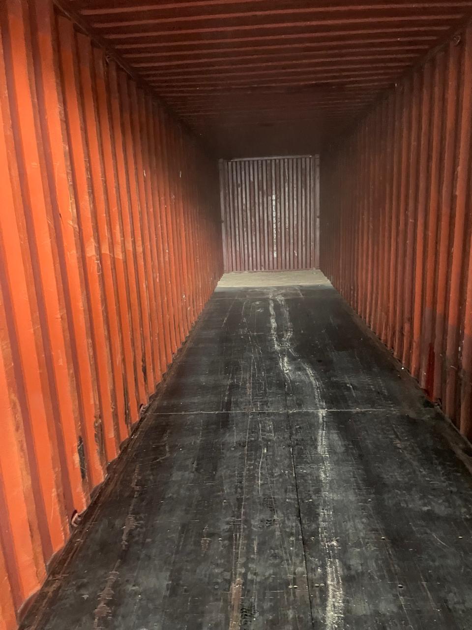 Empty red 40ft High-Cube, pre-load inspection