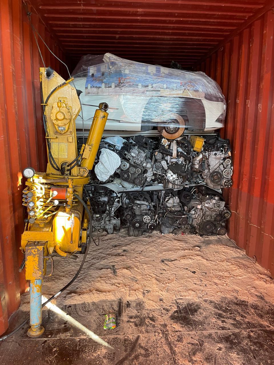 Crane-assisted load, wrapped half-cut over engine wall