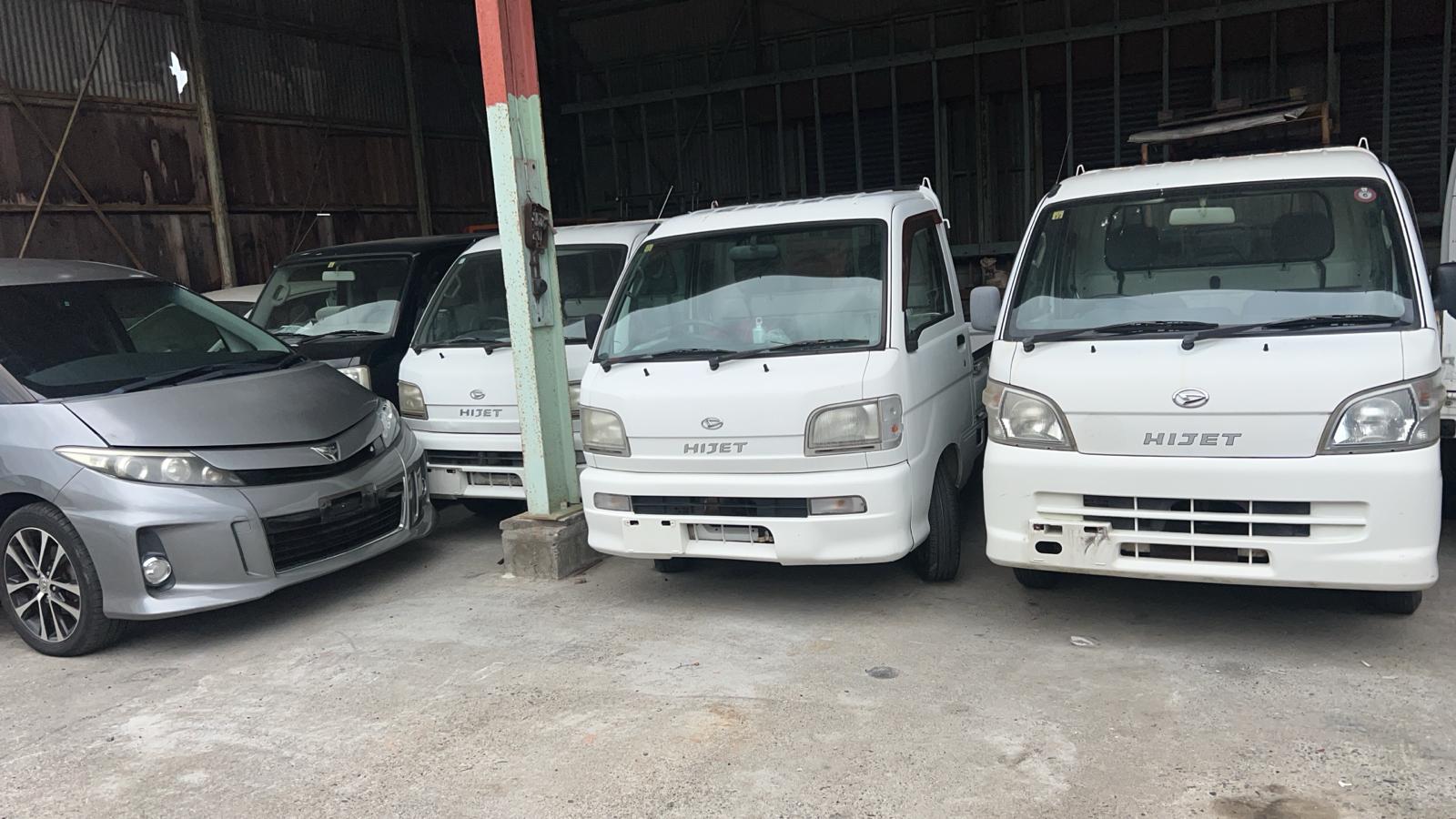 Daihatsu Hijet kei trucks under cover